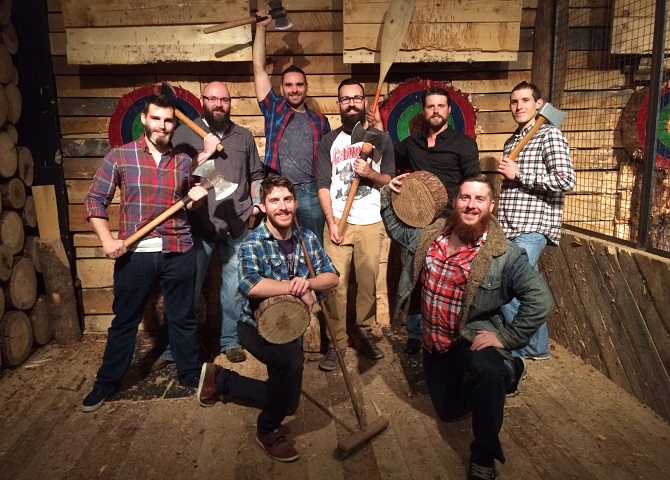 Bearded men holding axes, axe throwing, Nova Scotia Vacation, kids activities, winter season